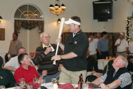 Miles Powell showing off an auction prize
