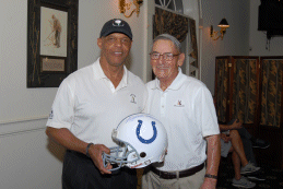 Lydell Mitchell with an autographed helmet for Dick Alaimo