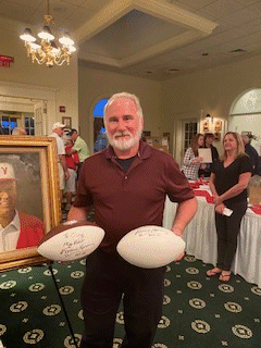 Walt with his autographed footballs